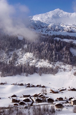 Chalets in the ski resort of Le Chinaillon with Aiguille Verte 2045m beyond in the Chane du Bargy Le GrandBornand HauteSavoie France