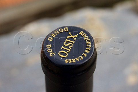 Capsule on bottle of Xisto an alliance between the Roquette family of Quinta do Crasto and the Cazes family of Bordeaux Produced from grapes grown at Ferrao in the Douro Valley Portugal Douro