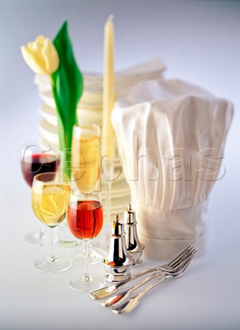 Restaurant icon still life of chefs hat glasses and cutlery