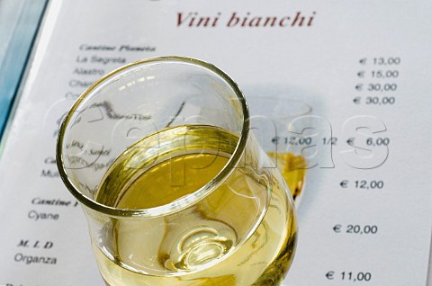 Glass of white wine on Sicilian wine list of the restaurant La Spiaggetta in Fontane Bianche Sicily