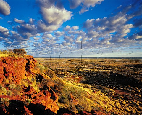 Orange cliffs at sunrise in the Durba Hills on the Canning Stock Route Little Sandy Desert Western Australia
