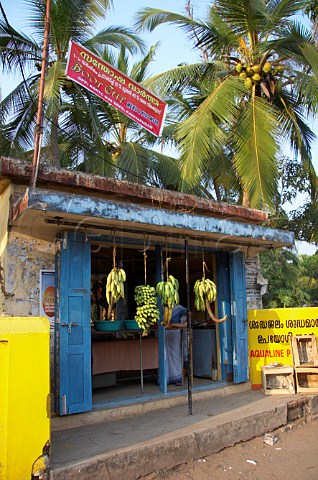 Bananas hanging for sale outside a small local store near Thiruvananthapuram Trivandrum Kerala India