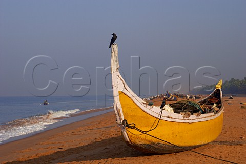 Fishing boat on the beach north of Thiruvananthapuram Trivandrum Kerala India