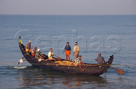 Fishermen returning after a night at sea north of Thiruvananthapuram Trivandrum Kerala India