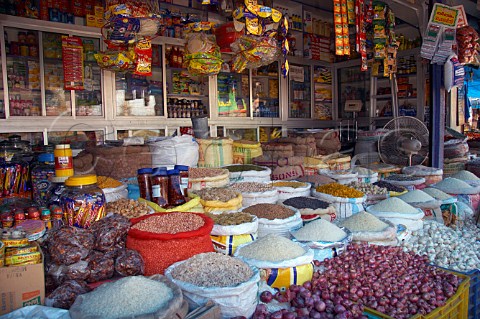 Rice shallots garlic bulbs and dried produce for sale at Connemara Market Thiruvananthapuram Trivandrum Kerala India