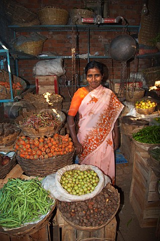 Woman selling fresh fruit and vegetables at Connemara Market Thiruvananthapuram Trivandrum Kerala India