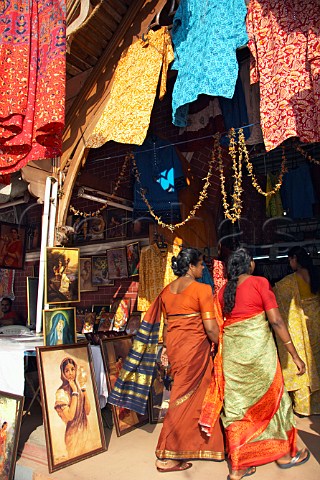Indian women entering exhibition of Indian handicrafts at Thiruvananthapuram Trivandrum Kerala India