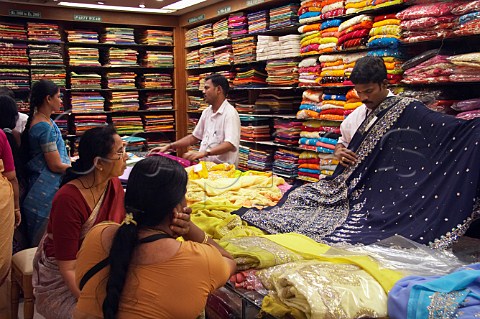 Cephas Picture Library - Asset Details 1209739- Women looking at sarees ...