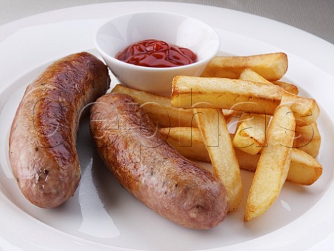 Pork sausages and chips with tomato sauce