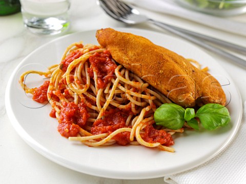 Wholewheat spaghetti Napolitana with chicken in breadcrumbs