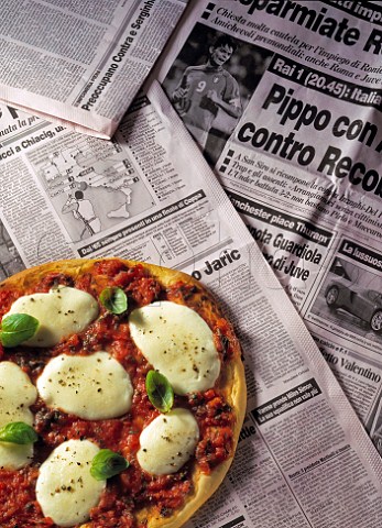 Pizza on Italian newspaper