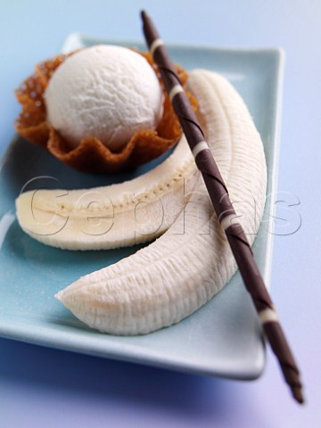 Banana split with icecream and chocolate wand