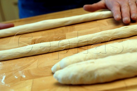 Rolling out dough for a bread plait