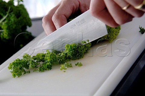Chopping parsley with a kitchen knife