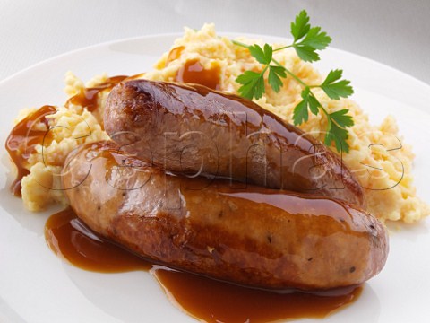 Pork sausages and cheese mash with gravy