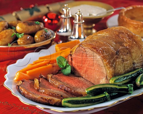 Roast beef and vegetables in a festive table setting