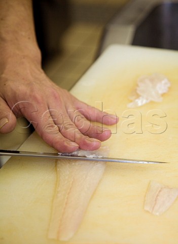 Slicing plaice for sashimi in a Japanese restaurant