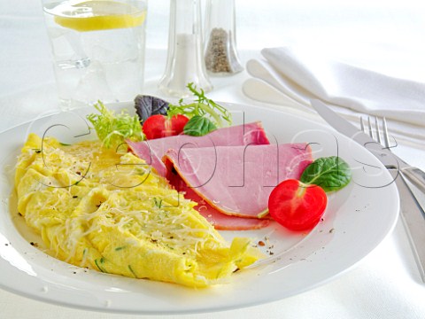 Omelette and ham with salad on the side