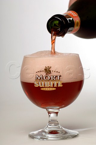 Pouring Mort Subite kriek beer into a balloon glass