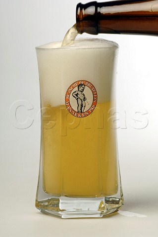 Pouring Glass of Blanche de Bruxelles Manneken Pis beer Brasserie Lefebvre Belgium