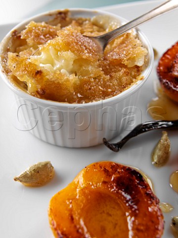 Ramekin of rice pudding with char grilled apricots