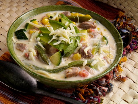 Mexican spicy pork soup with avocado