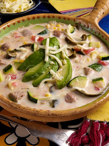 Mexican spicy pork soup with avocado