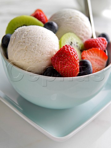 Fresh fruit with vanilla icecream and cream