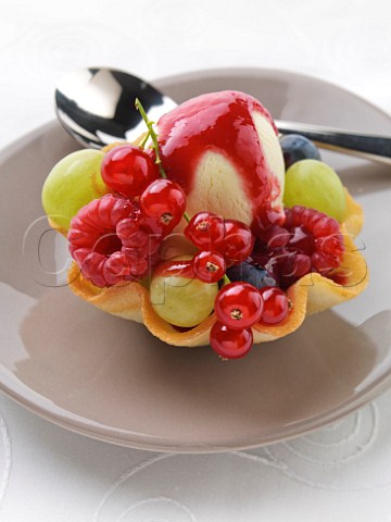 Summer fruits with vanilla icecream in a wafer basket