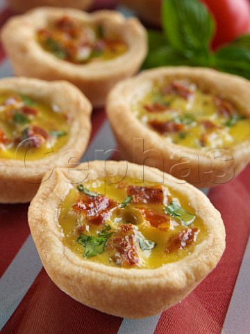 Mini sun dried tomato and herb tarts