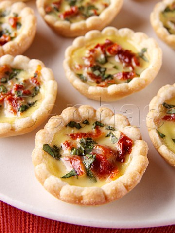 Mini sun dried tomato and herb tarts