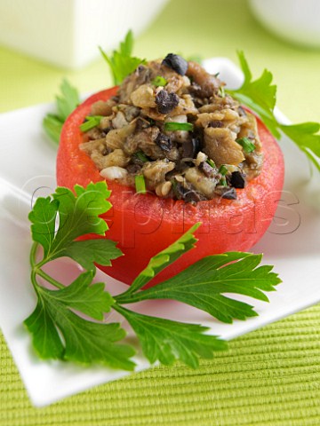 Aubergine and mushroom stuffed tomato