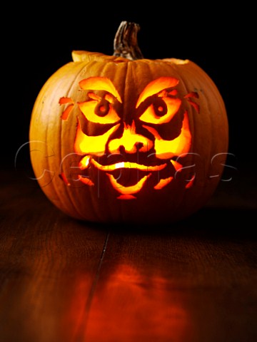 Lit carved pumpkin face