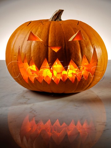 Lit carved pumpkin face