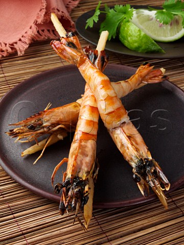 Prawns cooked on sugar cane sticks