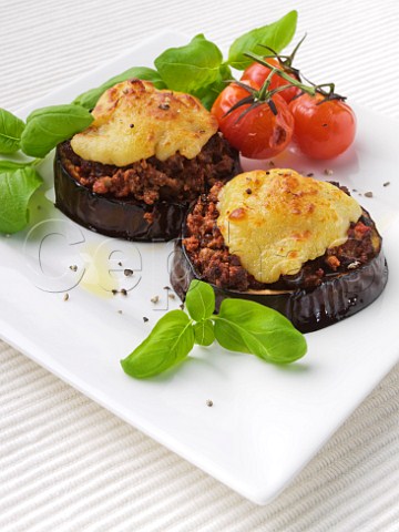 Quorn stuffed aubergine with grilled cheese topping and tomatoes