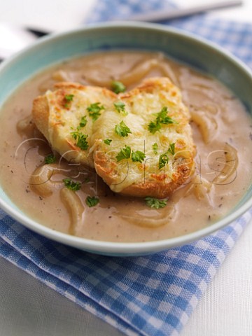 French onion soup with fried bread and melted cheese topping