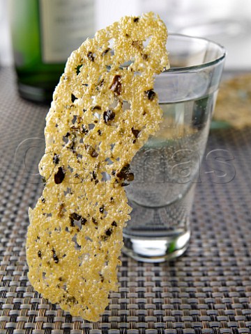 Seaweed cheese wafer and glass of white wine