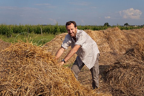 Thierry Germain with his piles of biodynamic compost which have been covered with straw for protection Domaine des Roches Neuves Varrains MaineetLoire France SaumurChampigny
