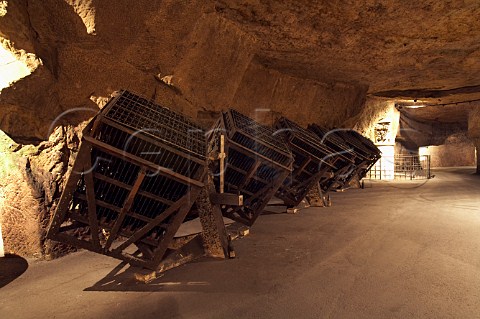 Bottles of sparkling wine in giropalettes in the cellars of BouvetLadubay which have been cut from the tuffeau subsoil  Saumur MaineetLoire France Crmant de Loire