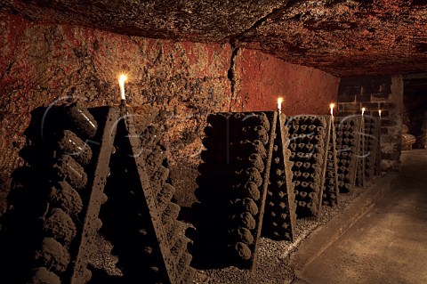 Bottles of sparkling wine in pupitres in the cellars of BouvetLadubay Saumur MaineetLoire France Crmant de Loire