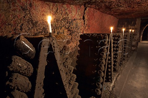 Bottles of sparkling wine in pupitres in the cellars of BouvetLadubay Saumur MaineetLoire France Crmant de Loire