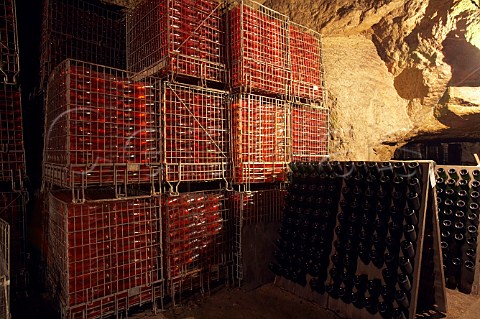Bottles of ros sparkling wine maturing in cellars of LangloisChteau which have been hewn out of the tuffeau subsoil at SteHilaireSteFlorent near Saumur MaineetLoire France Crmant de Loire