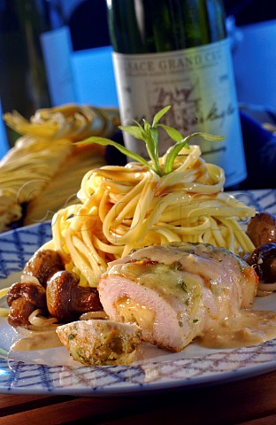 Cheese and herb chicken roll with mushrooms and noodles
