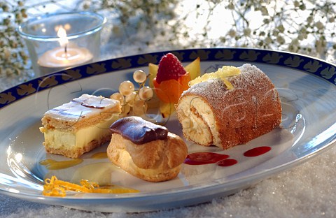 Assorted desserts millefeuille chocolate eclair sponge roll