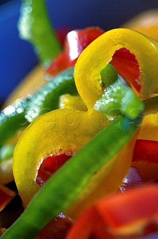 Sliced red green and yellow bell peppers