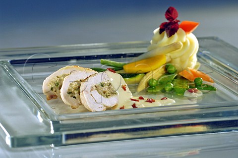 Roulade of breast of chicken with mixed vegetables and piped potato