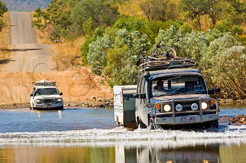 4WD at Pentecost River Crossing on the Gibb RIver Road Durack Range in background Western Australia