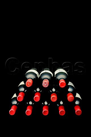 Stack of red wine bottles
