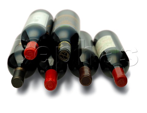 Capsules on bottles of red wine